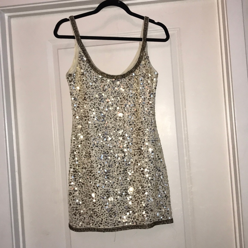 Cream with gold  and brown sequins.